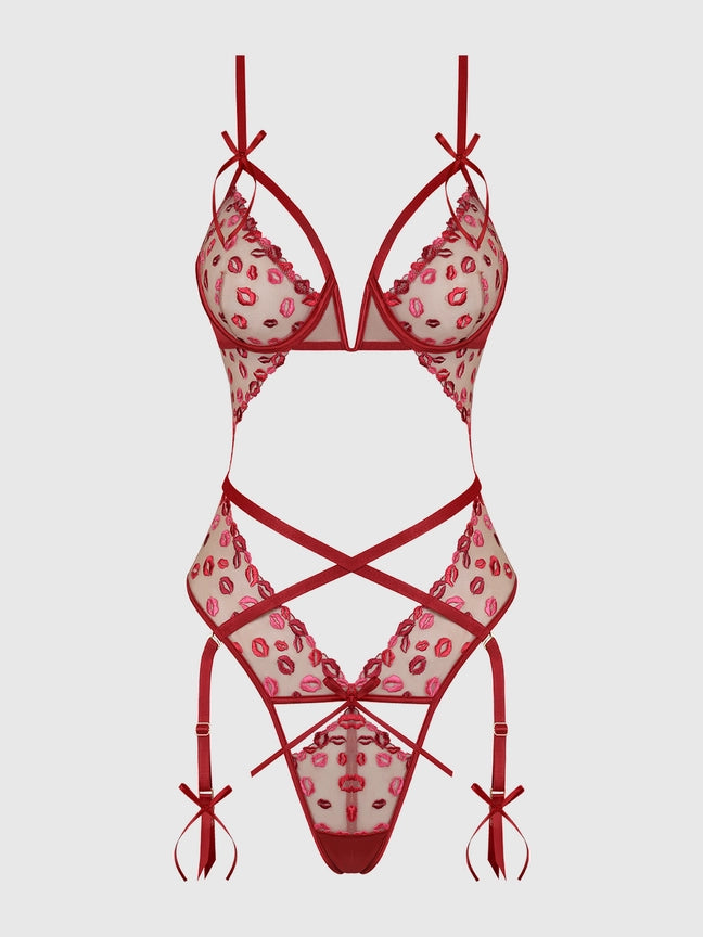 Angelina Lips Embroidery Cutout Teddy featuring vibrant red color, bold cuts, and cheeky lace detailing.