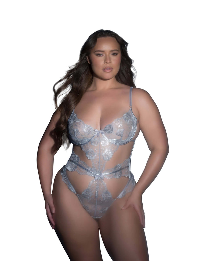 Model wearing Celeste Shimmer Teddy, a stunning metallic silver lingerie with embroidered lace detail.
