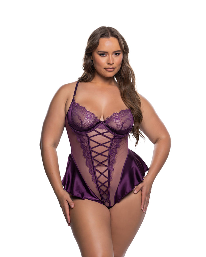 Beautiful model showcasing the Cheri Amore Teddy, a beautiful sexy lingerie piece in purple lace and satin.