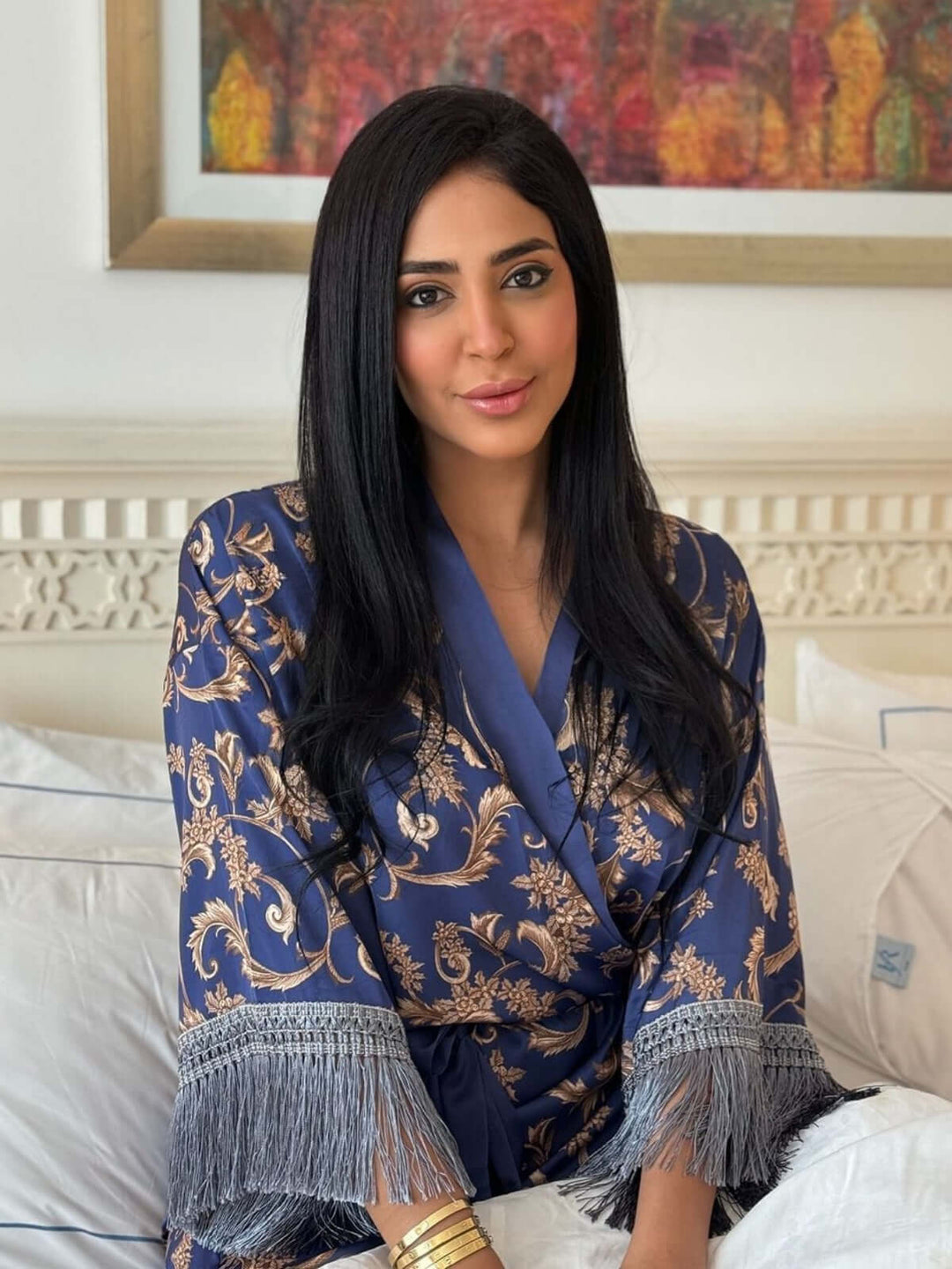 Woman wearing a Tassels Blue Kimono Robe, showcasing luxury and elegance with intricate details.