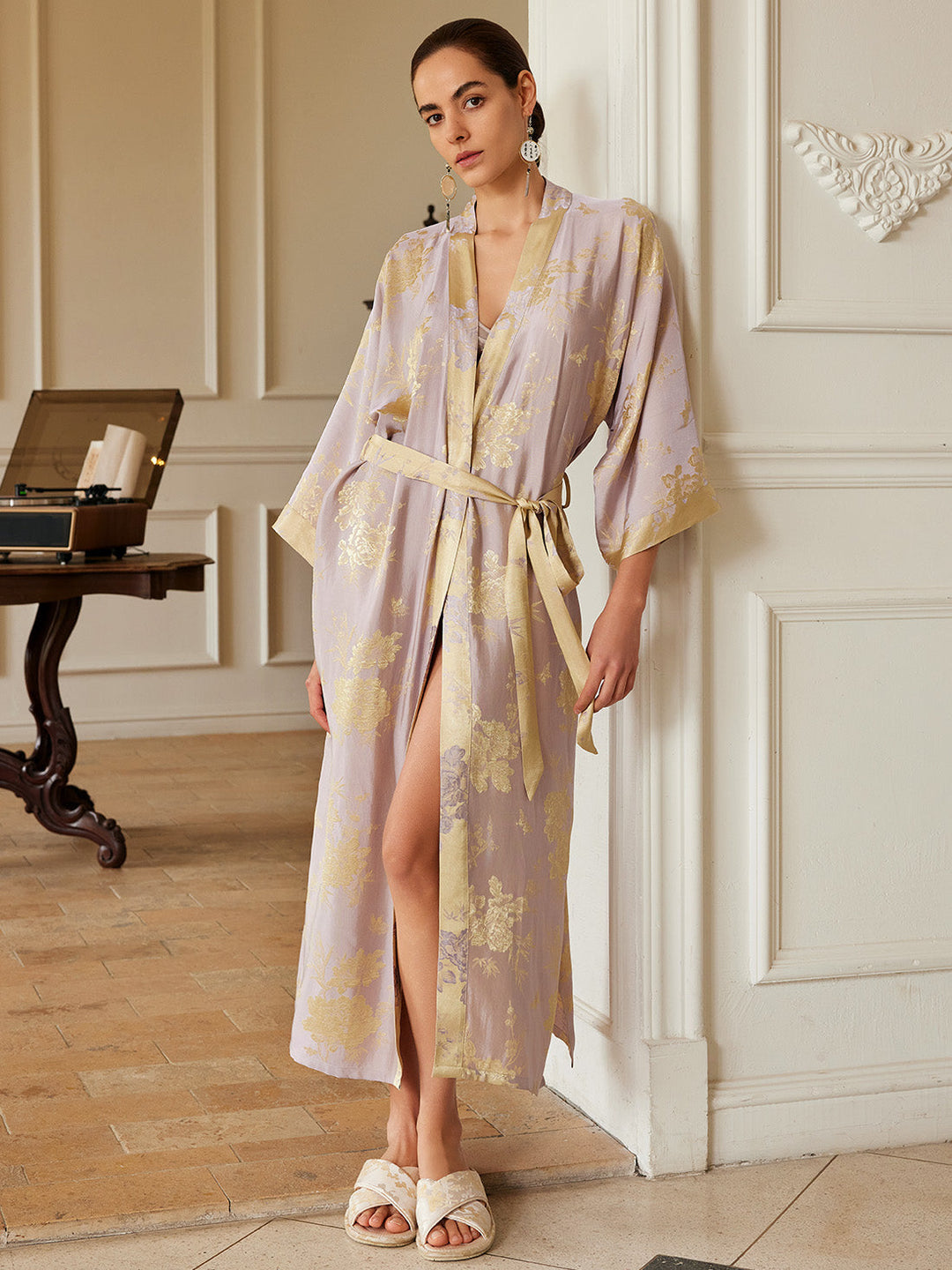 Woman in a Reversible Lavender & Gold Jacquard Kimono Robe, showcasing luxury and elegance.