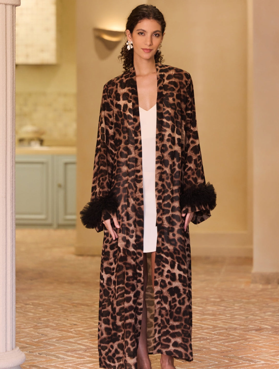 Wild Leopard Kimono Robe featuring bold leopard print and black ring detail on sleeves, exuding luxury and style.
