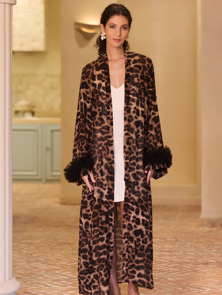 Wild Leopard Kimono Robe featuring bold leopard print and black ring detail on sleeves, exuding luxury and style.