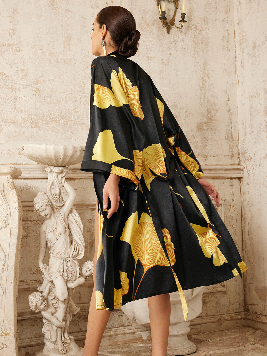 Yellow Ginkgo Leaf Print Black Kimono Robe showcased in a stylish setting with elegant design elements.