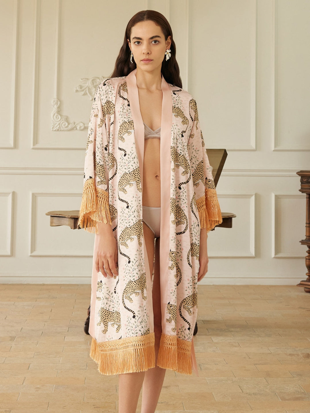 Model wearing a Pink Leopard Tassel Kimono Robe, showcasing its chic pink leopard print and elegant tassels.