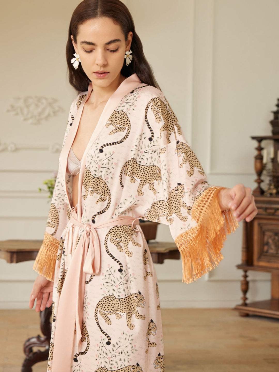 Model wearing a Pink Leopard Tassel Kimono Robe with chic pink leopard print and tassels, showcasing luxury loungewear.