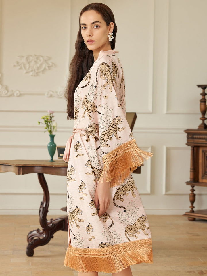 Model wearing a Pink Leopard Tassel Kimono Robe, showcasing chic pink leopard print and golden tassels.