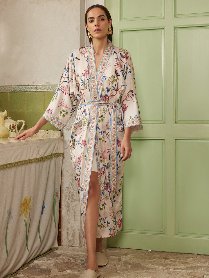 Beige Chinoiserie Floral Long Kimono Robe with Pockets worn by a model in a vintage setting.