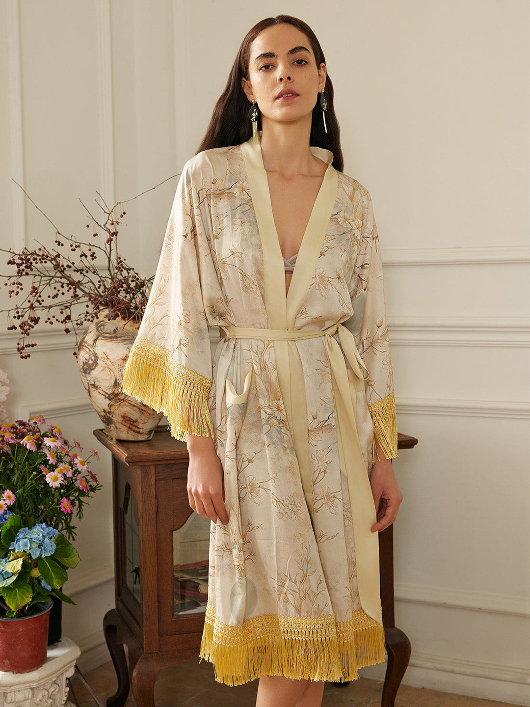 Gold Eastern Floral Vase Kimono Robe with Pockets worn by a model, featuring champagne gold design and luxurious tassels.