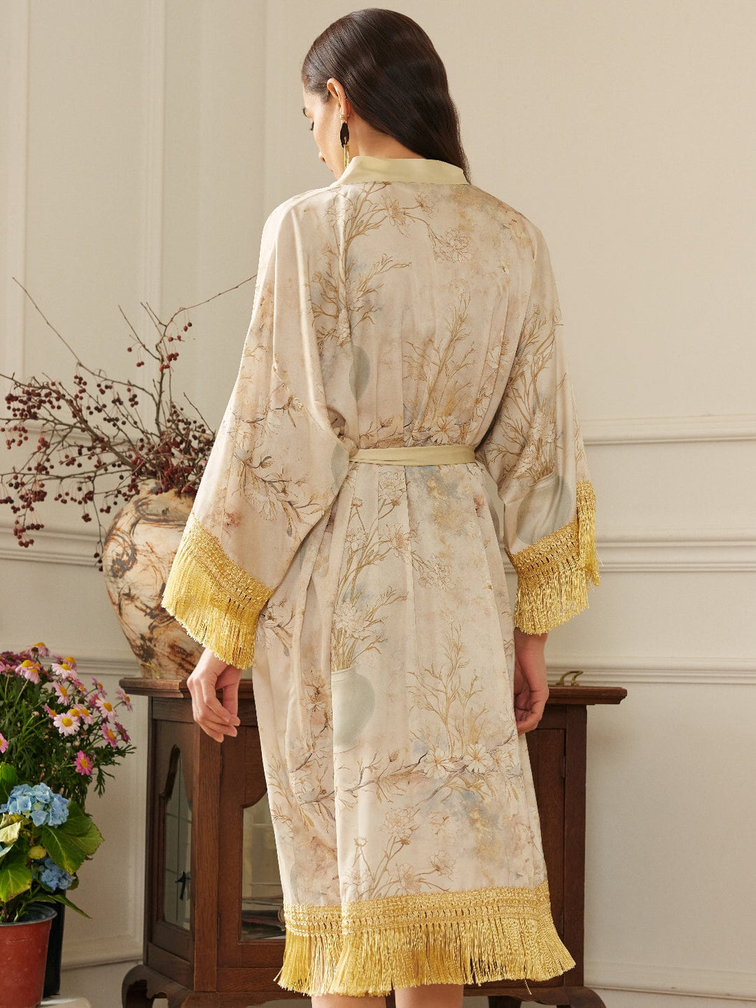 Back view of the Gold Eastern Floral Vase Kimono Robe with Pockets showcasing luxurious gold tassels and floral design.