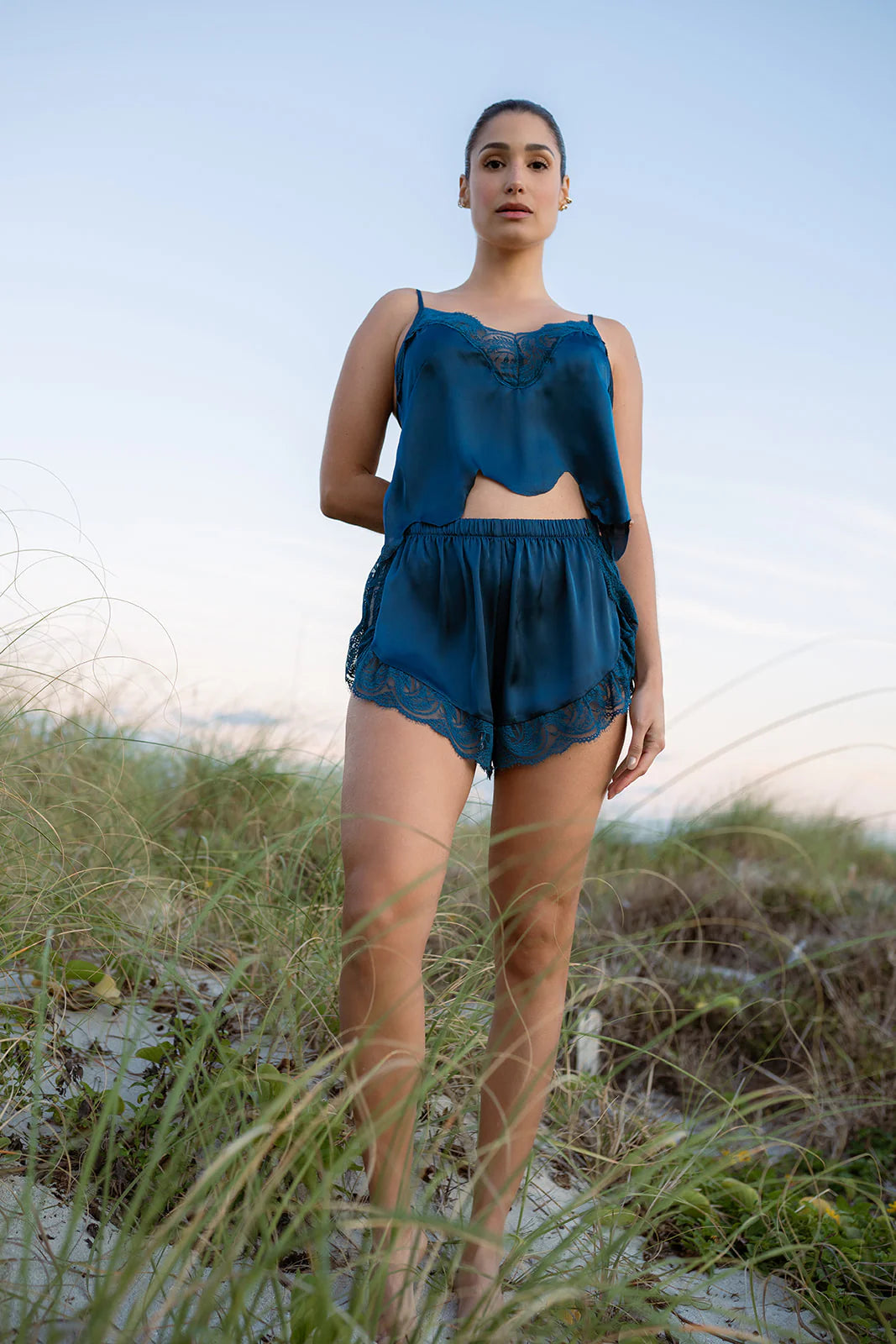 Model wearing the Hydros Satin and Lace Cami and Shorts Set, showcasing luxurious satin and lace details in an outdoor setting.
