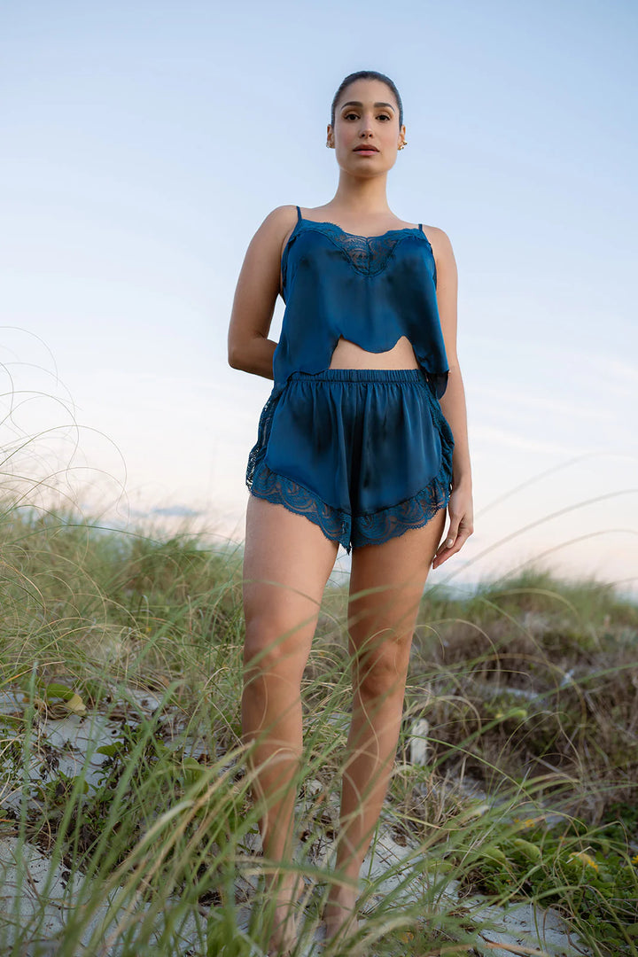 Model wearing the Hydros Satin and Lace Cami and Shorts Set, showcasing luxurious satin and lace details in an outdoor setting.