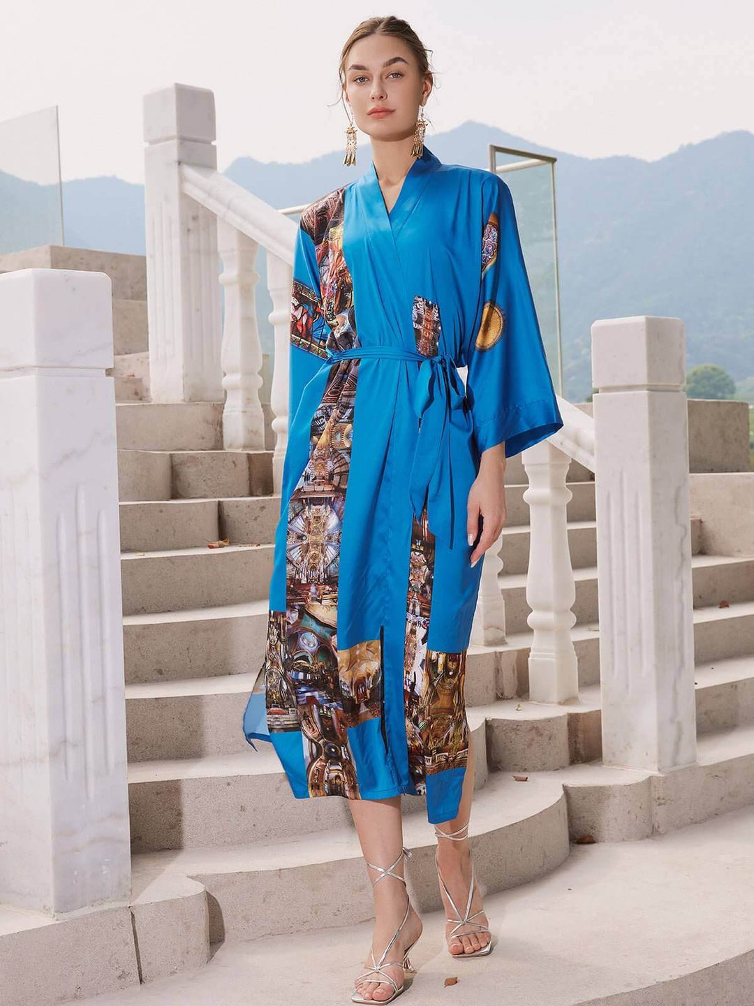Model wearing a Paris Cathedral Kimono Robe in vibrant blue, showcasing luxurious fabric and stylish design.