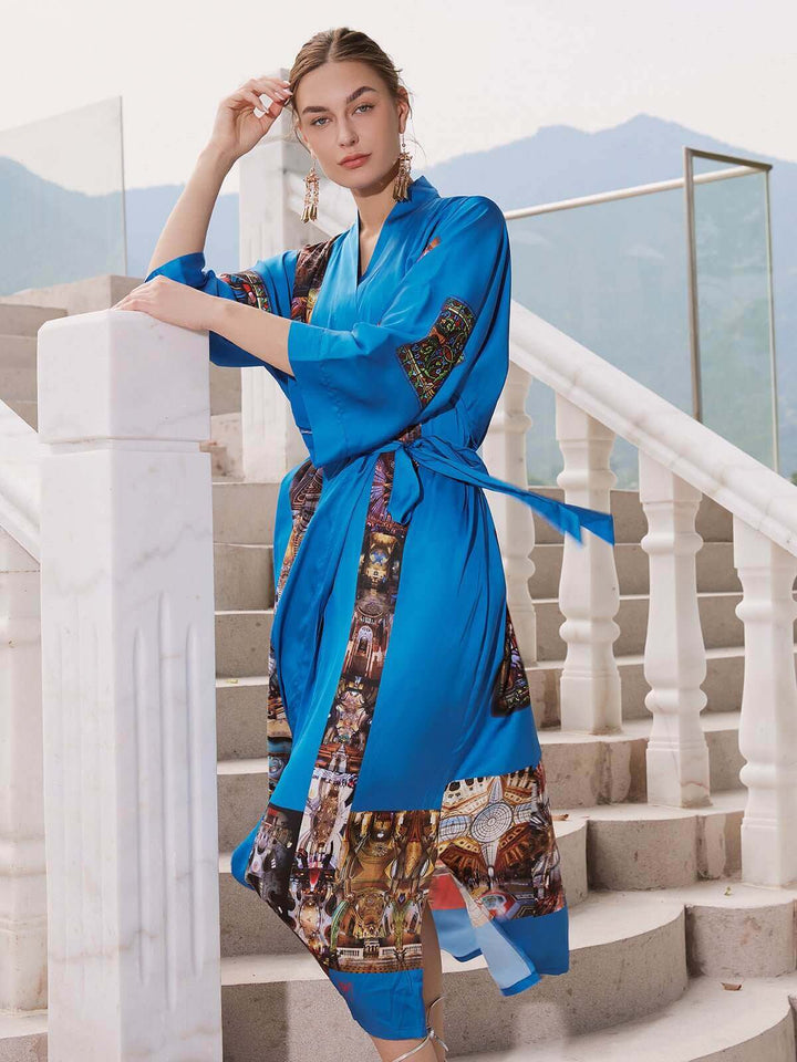 Model showcasing the elegant Paris Cathedral Kimono Robe in vibrant blue, epitomizing luxury and comfort.