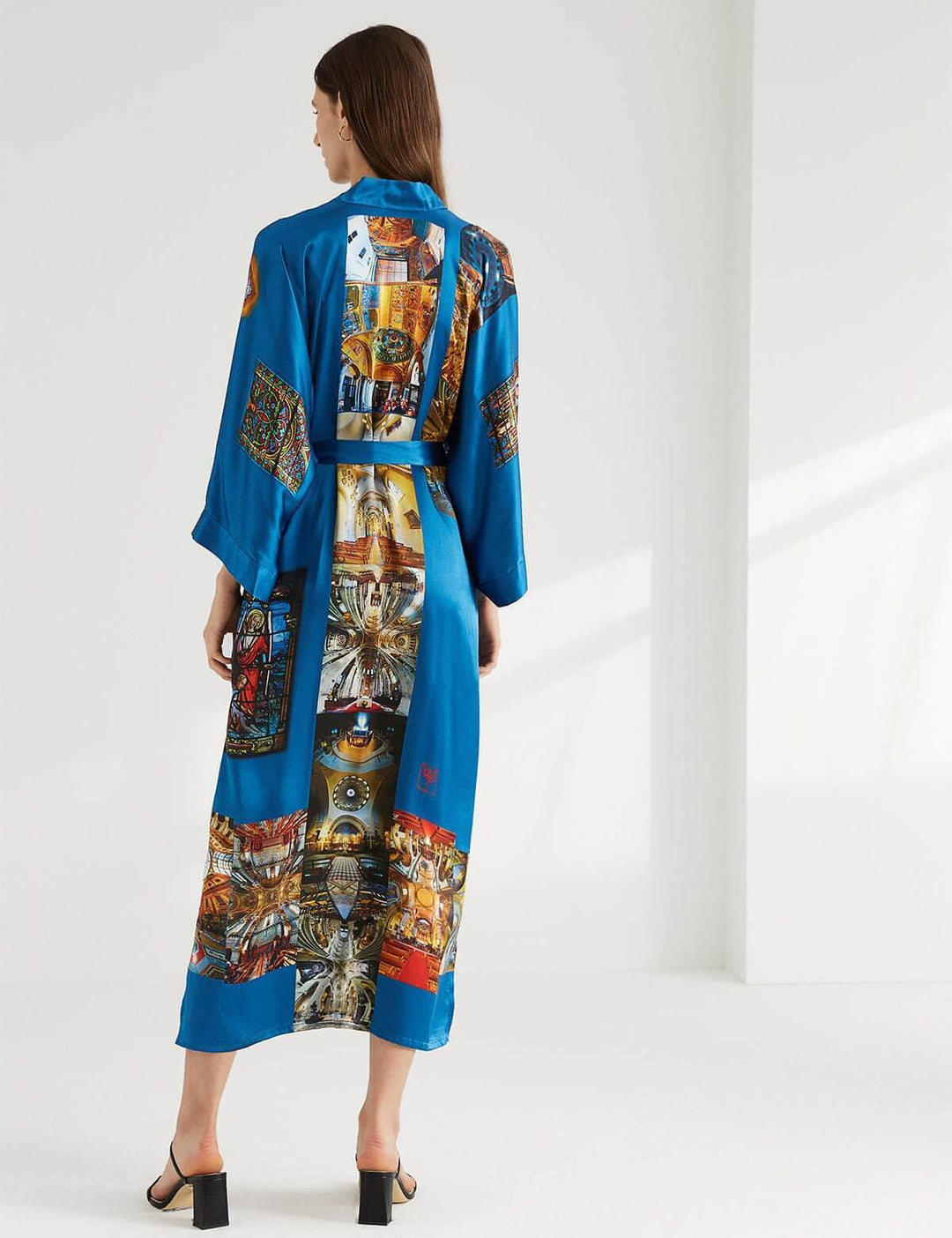 Model showcasing the elegant Paris Cathedral Kimono Robe with a vibrant design and luxurious feel.