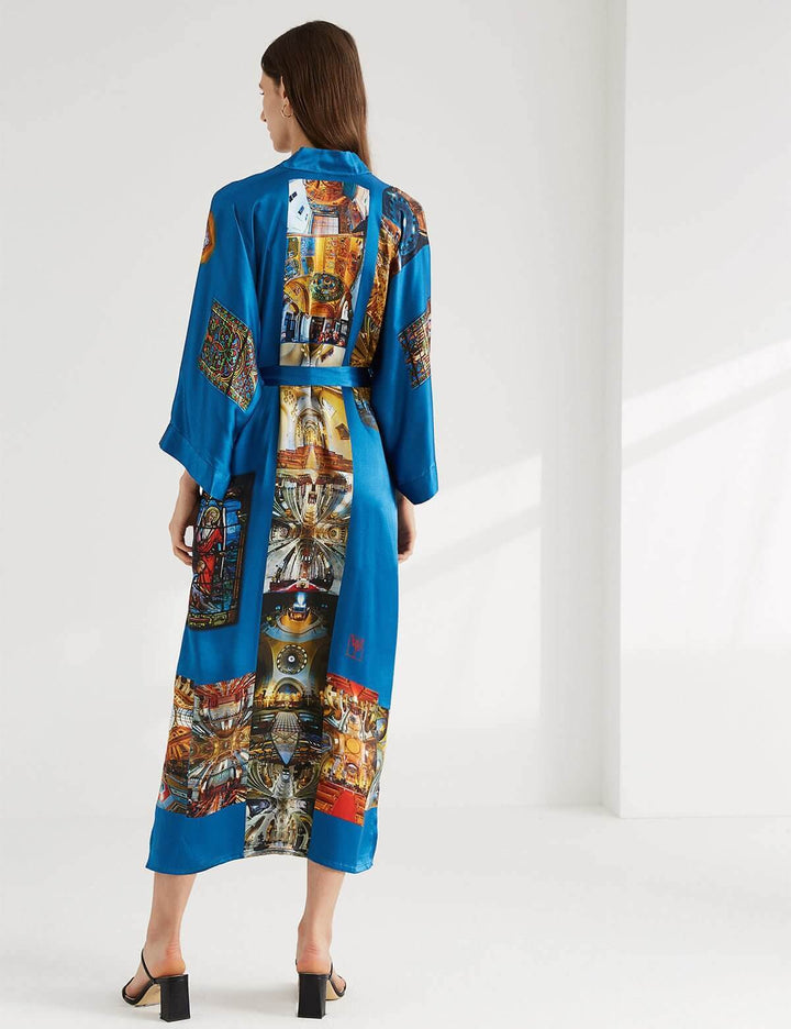 Model showcasing the elegant Paris Cathedral Kimono Robe with a vibrant design and luxurious feel.