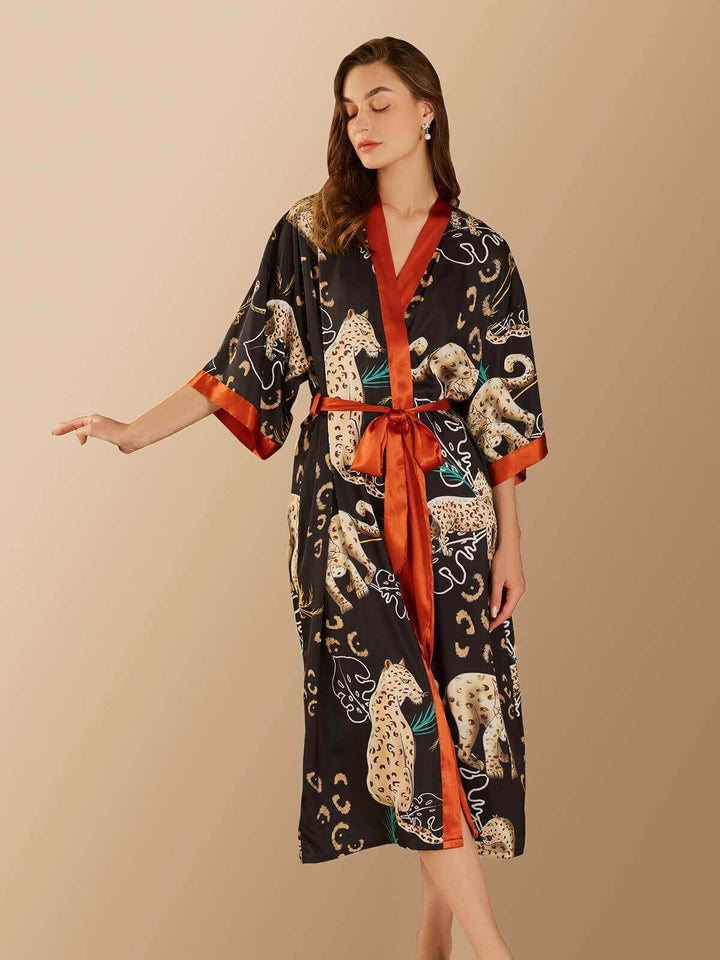 Elegant woman in a Jungle Animals Kimono Robe featuring hand-painted jungle animal prints.