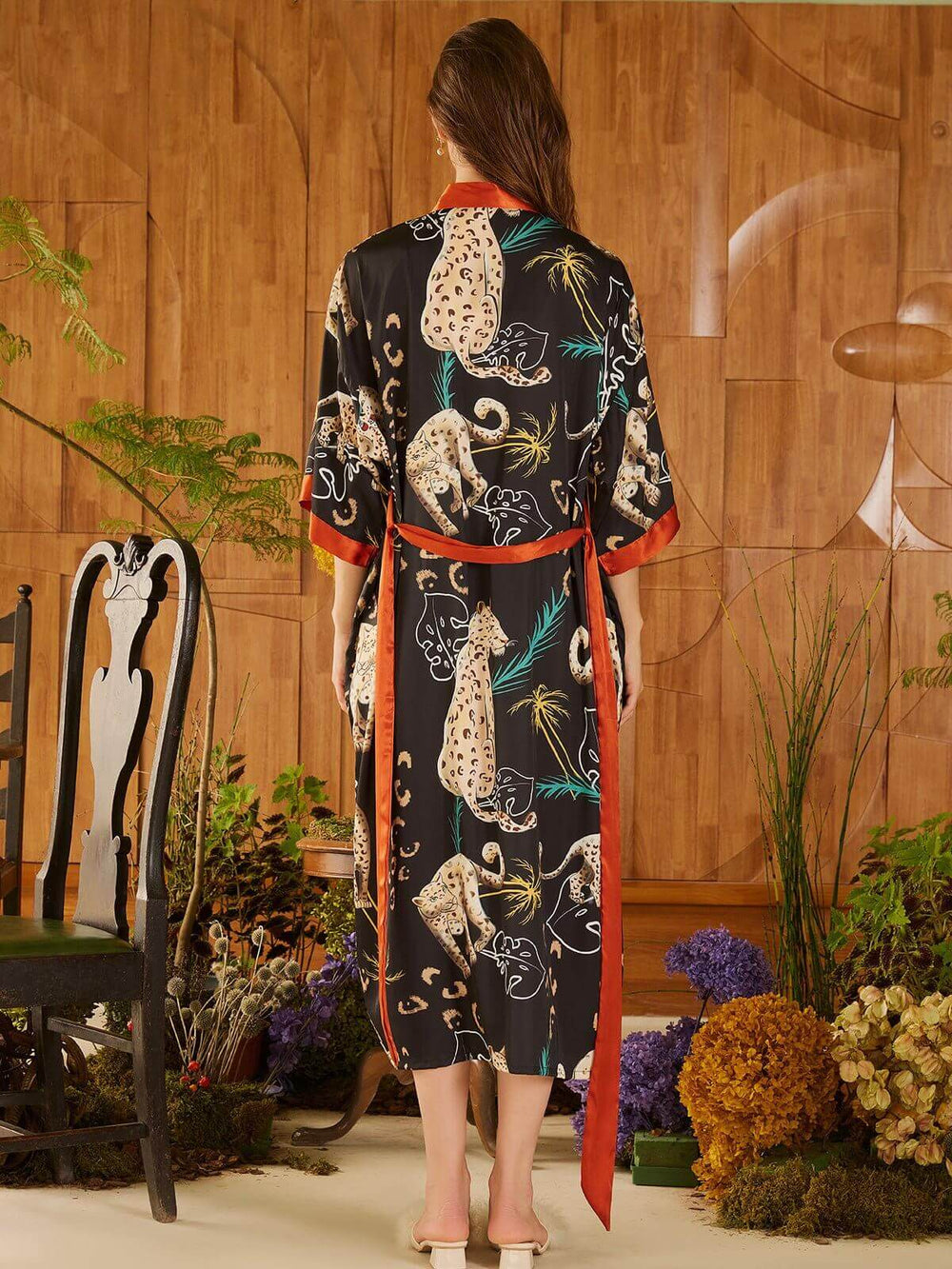 Back view of a model wearing a Jungle Animals Kimono Robe with vibrant jungle animal prints.