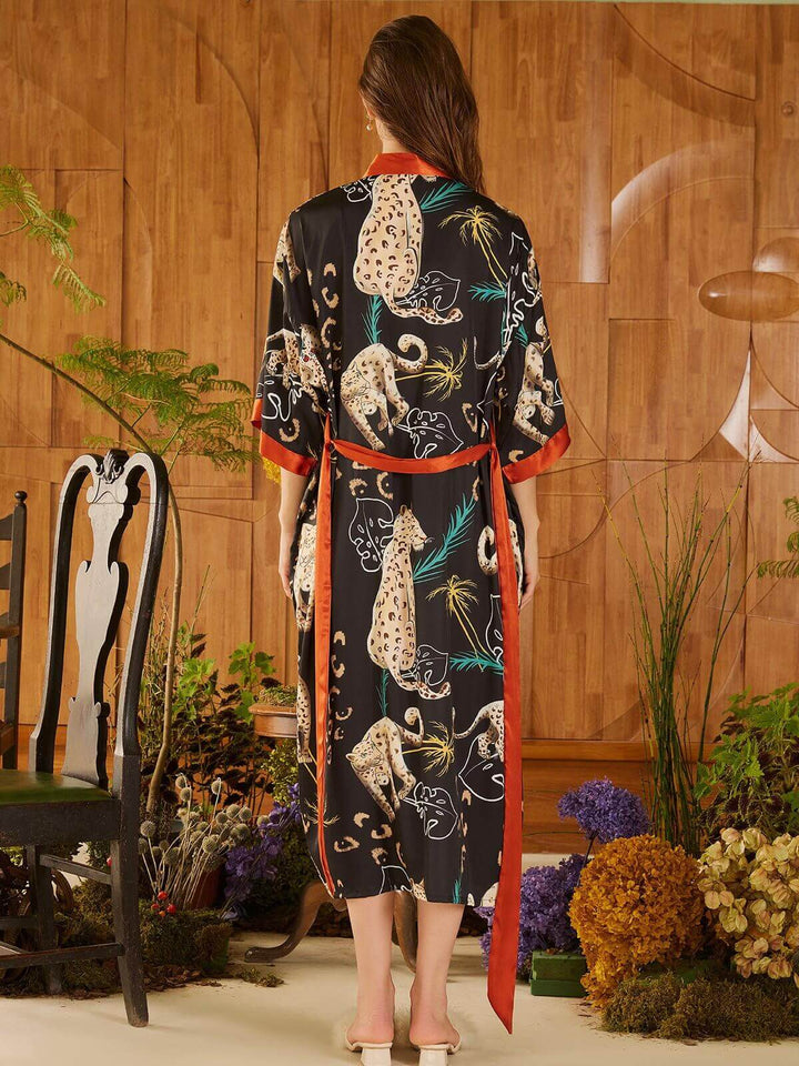 Back view of a model wearing a Jungle Animals Kimono Robe with vibrant jungle animal prints.