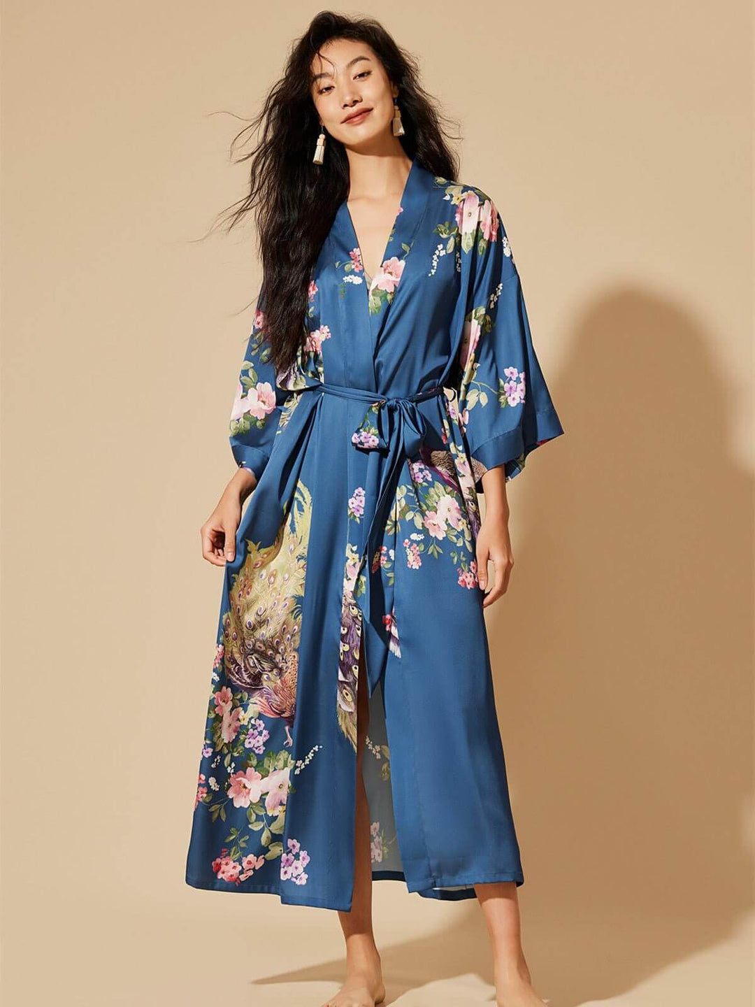 Model wearing a Peacock Blue Kimono Robe with floral prints, showcasing luxurious comfort and style.