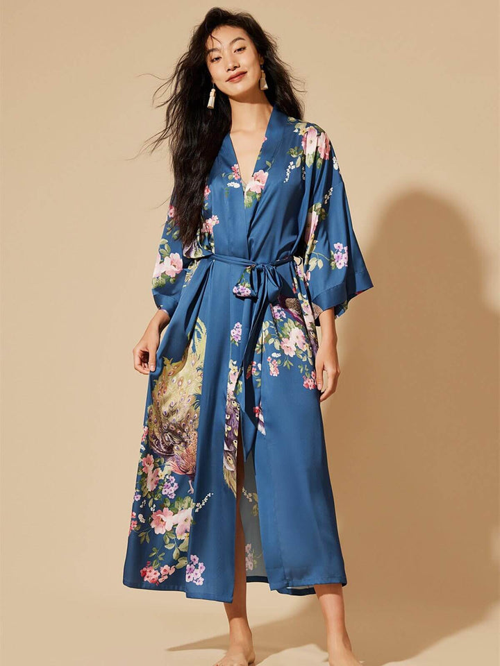 Model wearing a Peacock Blue Kimono Robe with floral prints, showcasing luxurious comfort and style.