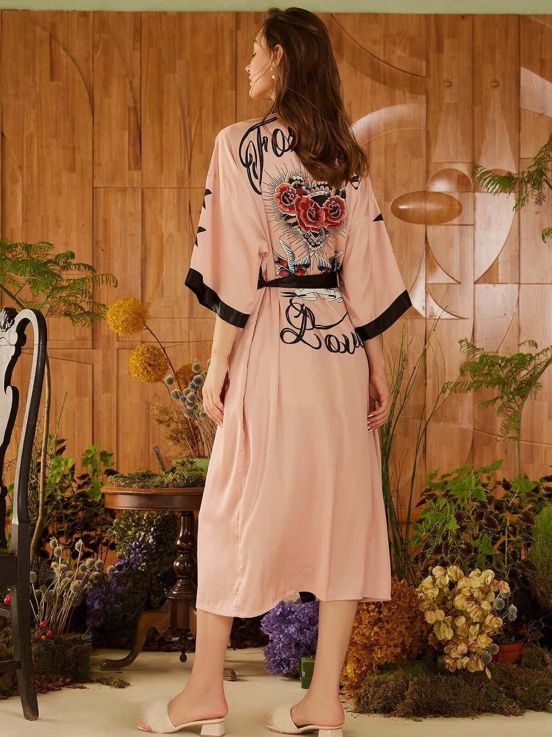 Rose Butterfly Kimono Robe displayed on a model showcasing its luxurious floral design and silky texture.
