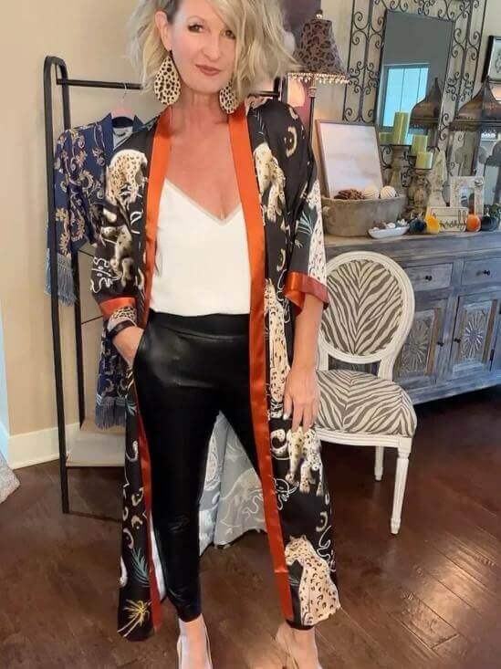 Woman wearing a Jungle Animals Kimono Robe with elegant details and stylish outfit, showcasing luxury comfort.