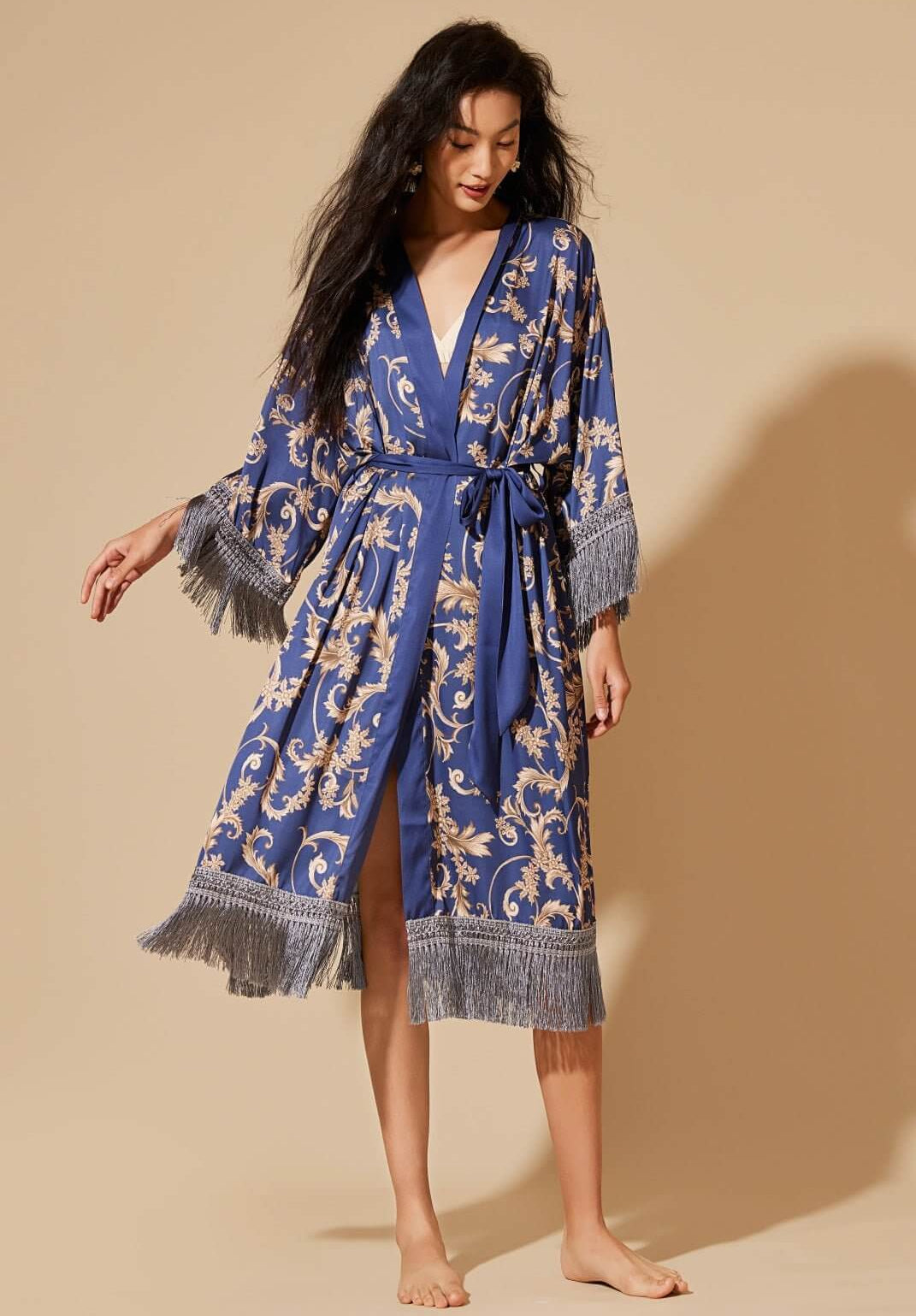 Tassels Blue Kimono Robe showcasing luxurious design and silky comfort with elegant fringes and floral patterns.