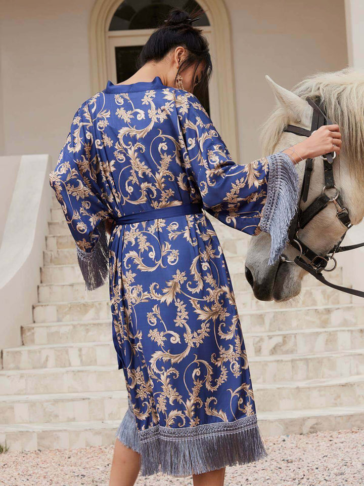 Woman wearing a Tassels Blue Kimono Robe, styled elegantly with intricate patterns, standing next to a horse.