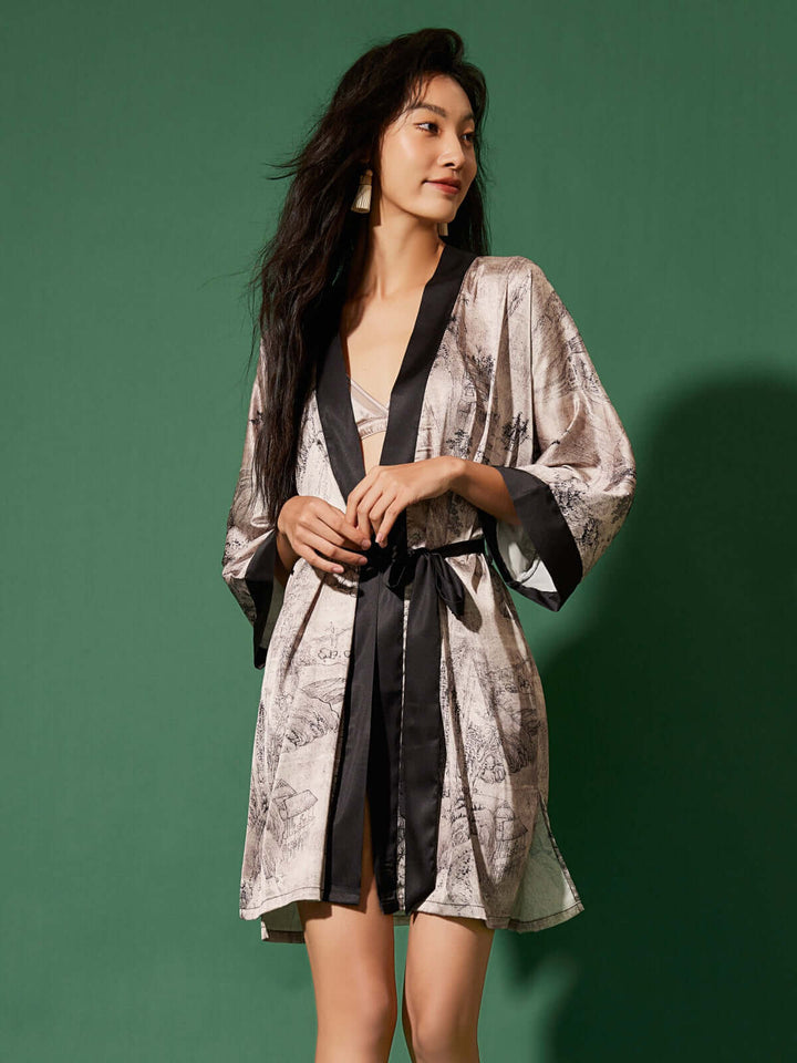 Short Kimono Robe Ink Painting displayed on model against a green background, showcasing luxury and elegance.