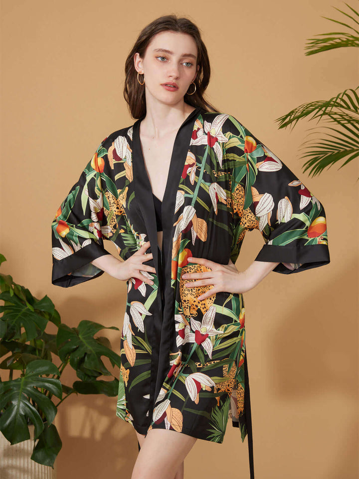 Short Kimono Robe Black Leopard displayed on a model showcasing its luxurious floral design and silky comfort.