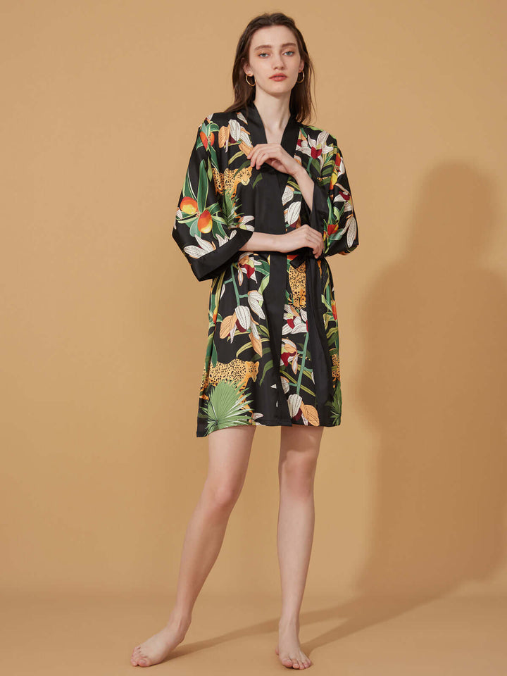 Short Kimono Robe Black Leopard on model with floral print against a neutral background, highlighting luxury and elegance.