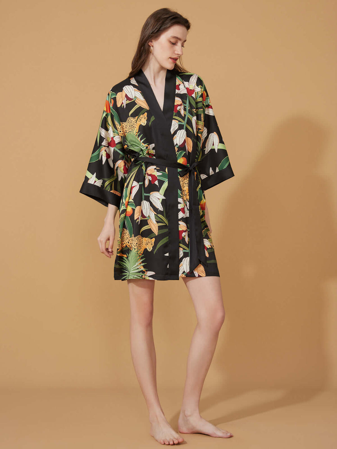 Short Kimono Robe Black Leopard displayed elegantly against a neutral background, showcasing its luxurious design and vibrant pattern.